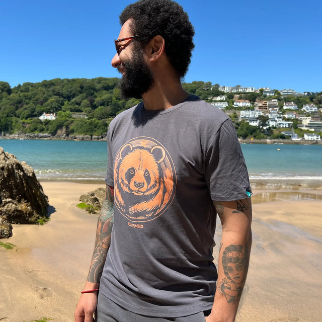 Men's Panda Graphic Bamboo T-Shirt. Man on a beach wearing the Jellymud panda graphic tee.