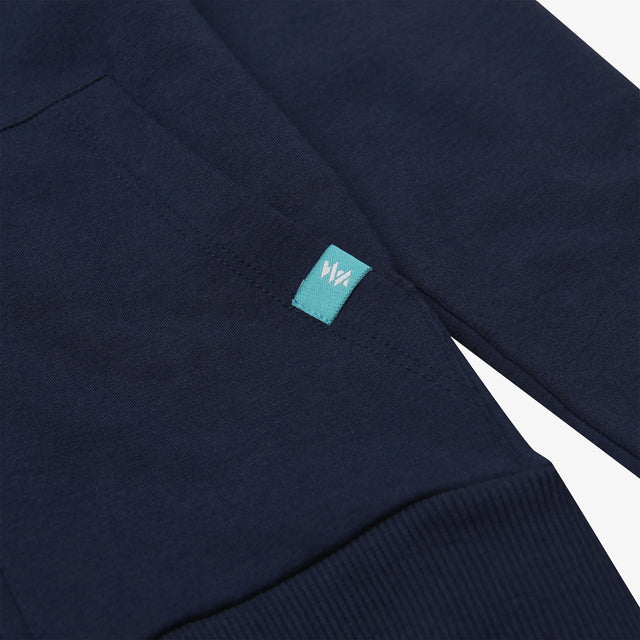Close-up of the pocket detail on the Juniors' Boulder Zip Through Hoodie, showcasing functional and stylish design.