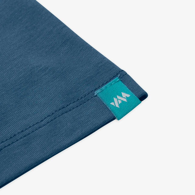 Close-up of Jellymud Juniors' Bamboo Altitude tee featuring a woven branded label on sleeve.