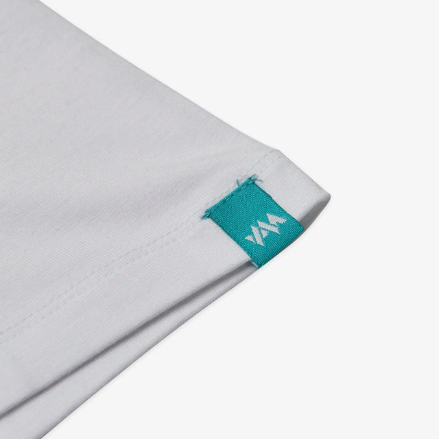 Close-up of Jellymud Juniors' Bamboo Altitude tee featuring a woven branded label on sleeve.