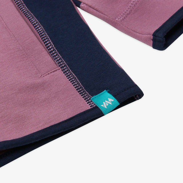 Close-up of the hem detail on the Kids' Ridge Quarter Zip Sweatshirt.