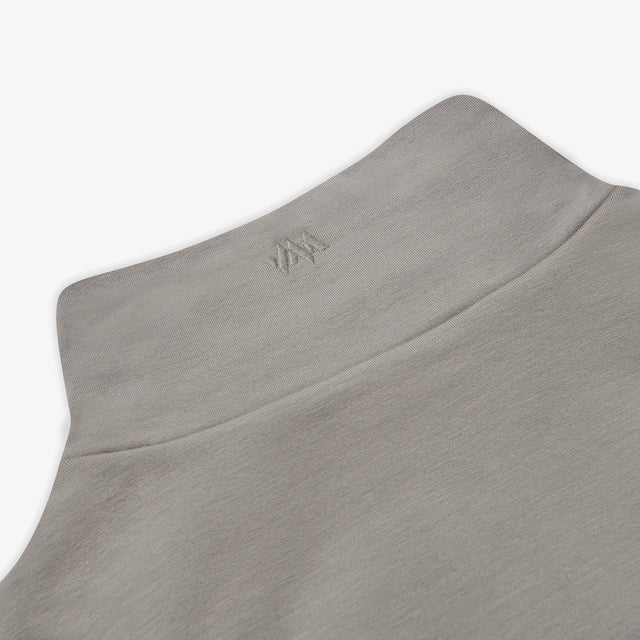 A close up view of the Jellymud Men's Peak Quarter Zip Sweatshirt featuring an embroidered logo on the collar.