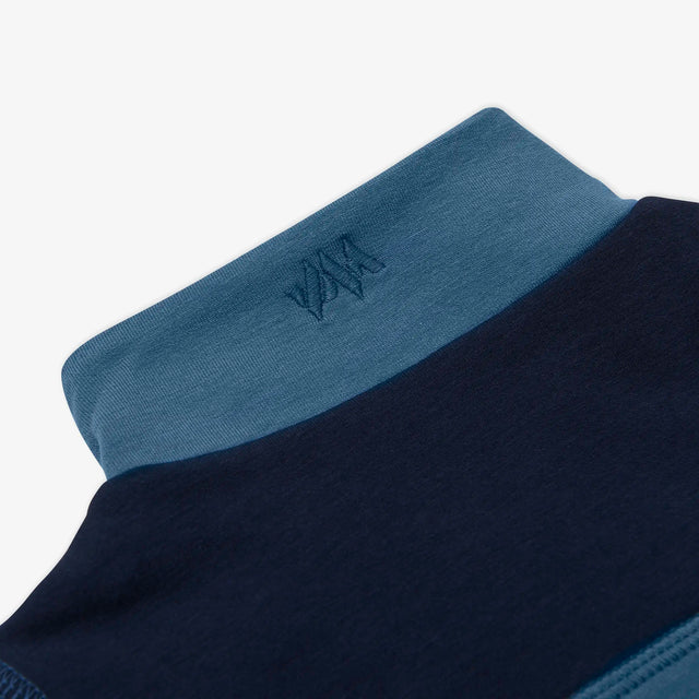 Close-up of the embroidered collar detail on the Kids' Ridge Quarter Zip Sweatshirt. 