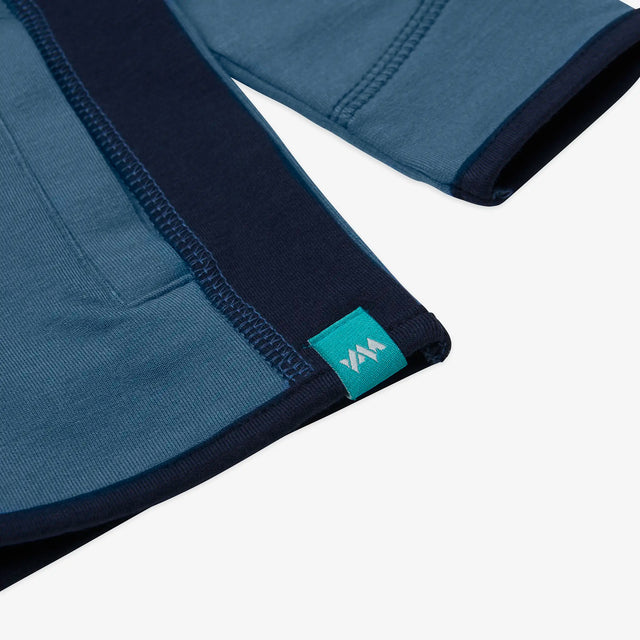 Close-up of the hem detail on the Kids' Ridge Quarter Zip Sweatshirt. 